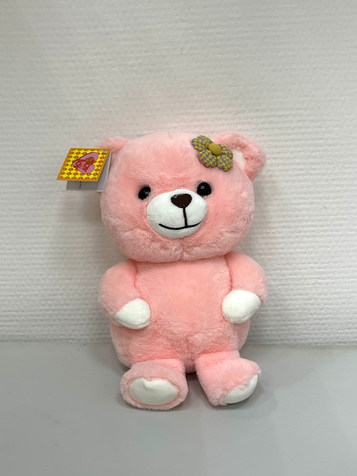 Мягкая игрушка «Мишка с цветочком» розовый 23 см